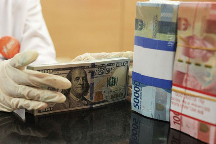 Rupiah Rabu pagi melemah 14 poin