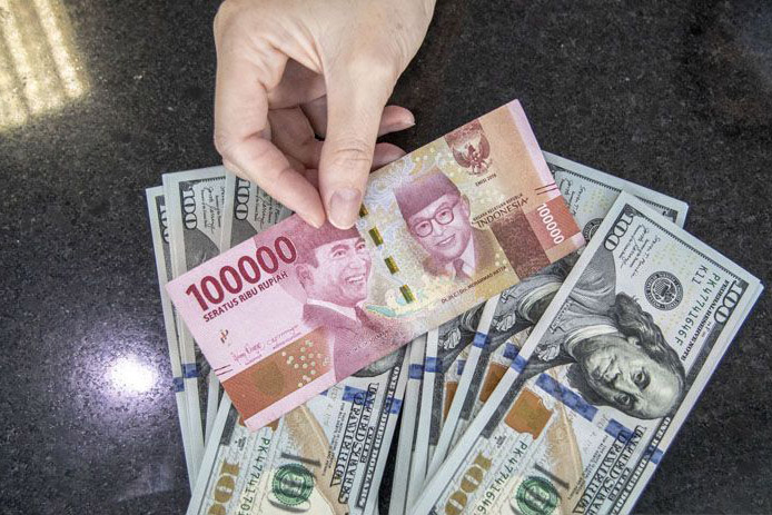 Rupiah Jumat pagi melemah 11 poin