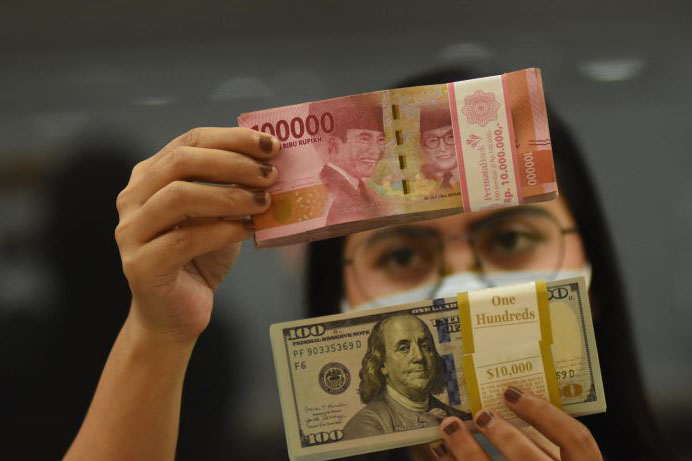 Rupiah Jumat pagi melemah tipis 2 poin