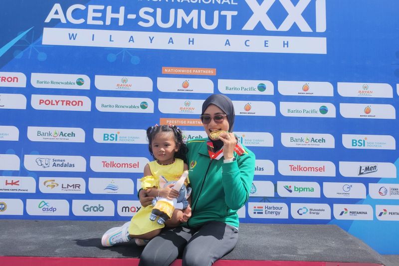 Menantang kontradiksi predikat ibu dan juara Menantang kontradiksi predikat ibu dan juara